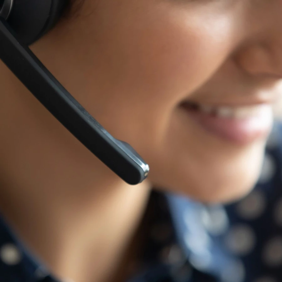 Telesales call center agent wear headset consult customer, closeup view